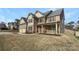 Charming two-story home with a covered front porch and a well-manicured front lawn at 111 Chaffee Pl, Mooresville, NC 28115