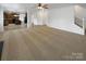 Open floor plan, showing living room that opens to kitchen with a staircase to the second floor at 111 Chaffee Pl, Mooresville, NC 28115