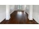 Open-concept living space with beautiful hardwood floors, detailed trim and lots of natural light at 111 Chaffee Pl, Mooresville, NC 28115