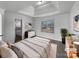 Staged main bedroom featuring a tray ceiling, a double window and ensuite bathroom at 111 Chaffee Pl, Mooresville, NC 28115