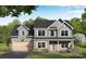 Charming two-story home featuring a craftsman style, gray siding, covered entry, and two-car garage at 1146 Nations Dr, Charlotte, NC 28217