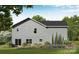 The backyard offers lush landscaping, a patio with sliding glass doors, and an expansive lawn at 1150 Nations Dr, Charlotte, NC 28217