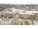 Aerial view of building complex with rooftop features and expansive parking, surrounded by commercial and residential areas at 1300 Reece Rd # 200, Charlotte, NC 28209