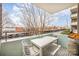 Cozy balcony with patio furniture and street views at 1300 Reece Rd # 200, Charlotte, NC 28209