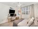 Cozy bedroom featuring a dedicated workspace and plenty of natural light from the large window at 1300 Reece Rd # 200, Charlotte, NC 28209