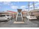 Low angle view showing covered parking area featuring vehicles and stairs leading up to a gated entrance at 1300 Reece Rd # 200, Charlotte, NC 28209