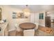Cozy dining room with a round table, decorative light fixture, and stylish decor at 1300 Reece Rd # 200, Charlotte, NC 28209