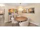 Bright dining room features a round table, designer light, and attractive wall decor at 1300 Reece Rd # 200, Charlotte, NC 28209