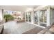 Contemporary building entrance with glass doors and a landscaped area at 1300 Reece Rd # 200, Charlotte, NC 28209