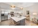 Modern kitchen with stainless steel appliances, white cabinets, and a central island with seating at 1300 Reece Rd # 200, Charlotte, NC 28209
