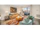 Cozy living room with colorful rug, stylish seating, and sliding doors to a private balcony at 1300 Reece Rd # 200, Charlotte, NC 28209