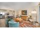 Bright living room featuring modern decor and an open floorplan to the kitchen at 1300 Reece Rd # 200, Charlotte, NC 28209