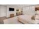 Large bedroom with a comfortable bed, modern decor, and plenty of natural light at 1300 Reece Rd # 200, Charlotte, NC 28209