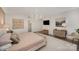 Spacious main bedroom features a large rug, modern art, and ensuite bathroom access at 1300 Reece Rd # 200, Charlotte, NC 28209