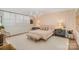 Stylish main bedroom with a unique accent wall, plush carpet, and bright chandelier at 1300 Reece Rd # 200, Charlotte, NC 28209