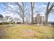 Street view of neighborhood homes and tall buildings with trees and park benches, creating a serene environment at 1300 Reece Rd # 200, Charlotte, NC 28209