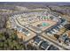 Aerial view showcasing the community layout, homes, and amenities including the pool at 138 Nicholson Ln, Mooresville, NC 28115
