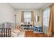 Brightly lit bedroom with a crib, toys, and a table with chairs at 148 Linwood Dr, Albemarle, NC 28001