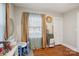 Well-lit bedroom featuring hardwood floors, toys, and an open doorway at 148 Linwood Dr, Albemarle, NC 28001