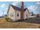 Charming home with classic architectural details, a brick chimney, and a well-maintained lawn at 148 Linwood Dr, Albemarle, NC 28001