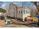 Charming home featuring classic architecture, a sunroom addition, and a well-manicured yard at 148 Linwood Dr, Albemarle, NC 28001