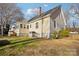 Classic home with a mix of siding and brick, complemented by a neatly kept lawn and mature trees at 148 Linwood Dr, Albemarle, NC 28001