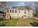 Beautiful home with a sunroom, lush lawn, mature trees, and a well-maintained landscape at 148 Linwood Dr, Albemarle, NC 28001