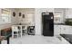 Bright kitchen with white cabinets, dining area, and modern appliances at 148 Linwood Dr, Albemarle, NC 28001