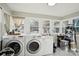 A large laundry room features modern appliances, bright lighting, and plenty of storage space at 148 Linwood Dr, Albemarle, NC 28001