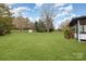 A spacious and well-maintained backyard provides ample outdoor space for recreation and relaxation at 1498 Oakridge Farm Hwy, Mooresville, NC 28115