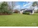A lush backyard offering ample space for outdoor activities and gardening at 1498 Oakridge Farm Hwy, Mooresville, NC 28115