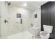 This bathroom has a spacious glass enclosed shower, tiled walls, and modern fixtures at 1498 Oakridge Farm Hwy, Mooresville, NC 28115