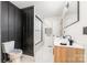 Modern bathroom features a double sink vanity, marble floors, and glass shower at 1498 Oakridge Farm Hwy, Mooresville, NC 28115