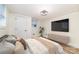 This bedroom features a modern light fixture and a large television set for entertainment at 1498 Oakridge Farm Hwy, Mooresville, NC 28115