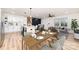 Open-concept dining area seamlessly flows into the living room and kitchen at 1498 Oakridge Farm Hwy, Mooresville, NC 28115