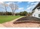 A beautifully landscaped front yard enhances the curb appeal of this charming residence at 1498 Oakridge Farm Hwy, Mooresville, NC 28115