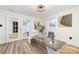 Bright home office with a modern desk, wood floors and a French door at 1498 Oakridge Farm Hwy, Mooresville, NC 28115