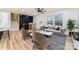Bright, spacious living room with hardwood floors, neutral decor, staircase and modern ceiling fan at 1498 Oakridge Farm Hwy, Mooresville, NC 28115