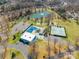 Overhead view of the community's amenities, including the pool, tennis courts, pond, and recreation center at 1515 Kingdom Way, Indian Land, SC 29707