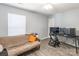 Bedroom with hardwood style flooring featuring a futon couch and an entertainment center at 1515 Kingdom Way, Indian Land, SC 29707