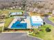 Aerial shot of the community pool, tennis courts, and recreation center with ample parking at 1515 Kingdom Way, Indian Land, SC 29707