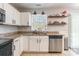 Bright kitchen featuring a stainless steel dishwasher and white cabinets at 1515 Kingdom Way, Indian Land, SC 29707
