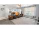 Living room with a brown couch, neutral colors, and a large window at 1515 Kingdom Way, Indian Land, SC 29707