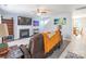 Inviting living room featuring a fireplace, TV, and view into the dining room at 1515 Kingdom Way, Indian Land, SC 29707