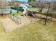 Community playground featuring swings, slides, and play structures, set amongst well-maintained lawns and trees at 1515 Kingdom Way, Indian Land, SC 29707