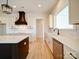 Bright, stylish kitchen with farmhouse sink, custom cabinetry, and black accents at 1706 Ruben Rd, Monroe, NC 28112