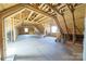 Open attic space shows exposed wooden beams, insulation, and natural light from multiple windows at 175 Riley'S Dr, Salisbury, NC 28146