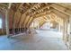 Spacious unfinished attic features exposed beams, insulation, and ample natural light at 175 Riley'S Dr, Salisbury, NC 28146