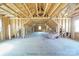 Unfinished attic space showing exposed beams and rafters, ready for customization and expansion at 175 Riley'S Dr, Salisbury, NC 28146