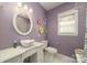 Traditional bathroom showcases a unique bowl sink, round mirror, and colorful floral decorations at 175 Riley'S Dr, Salisbury, NC 28146